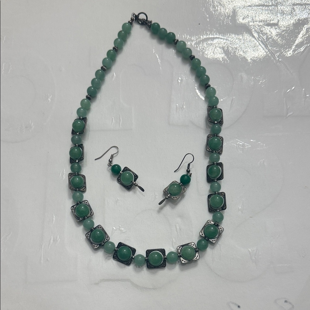 A vintage Green Beaded jade/aventurine necklace and earrings set is vintage